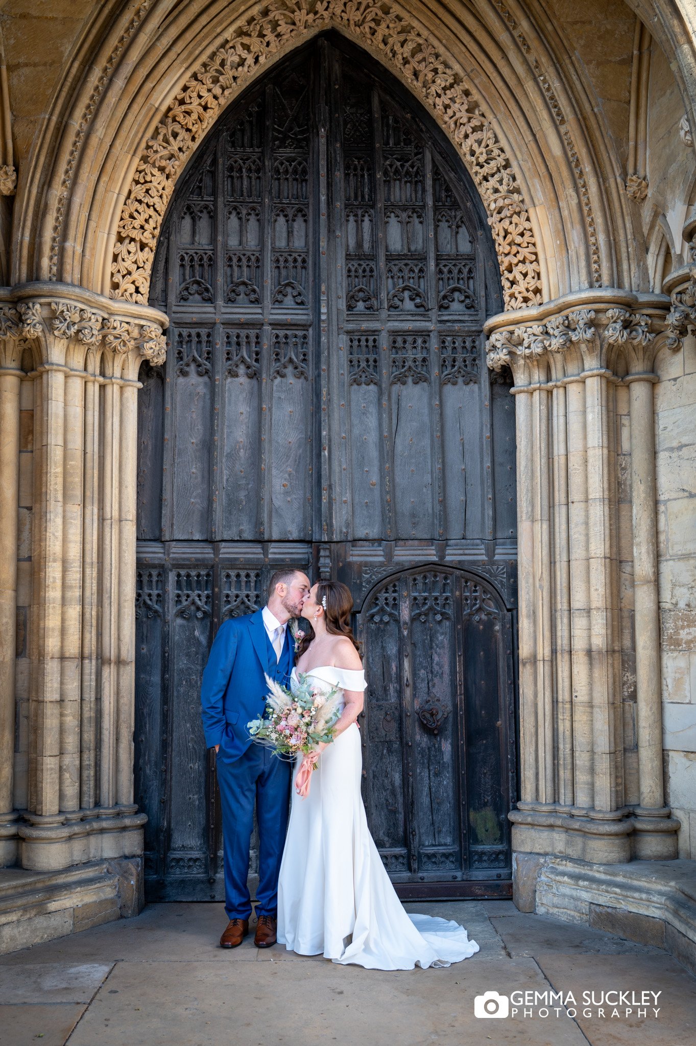 Bride and groom portrait at York Minster doors
