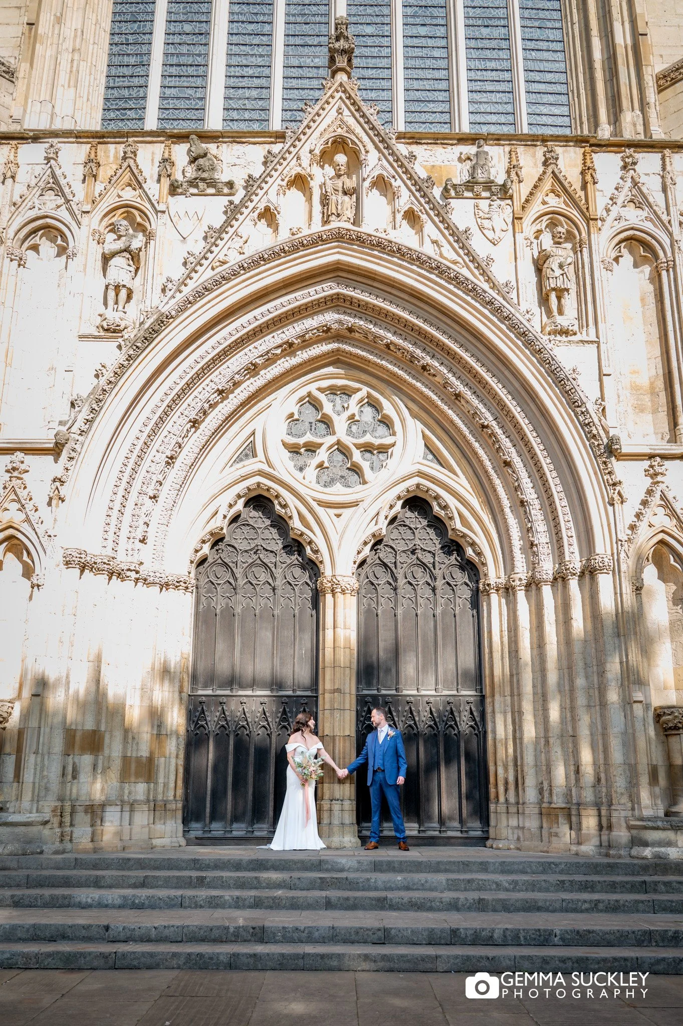 Bride and groom portrait at York Minster entrance