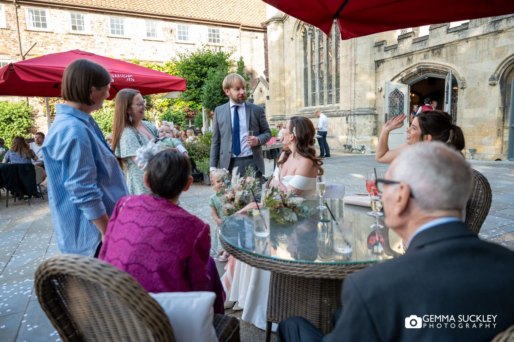 wedding guest mingling outside york minster refectory