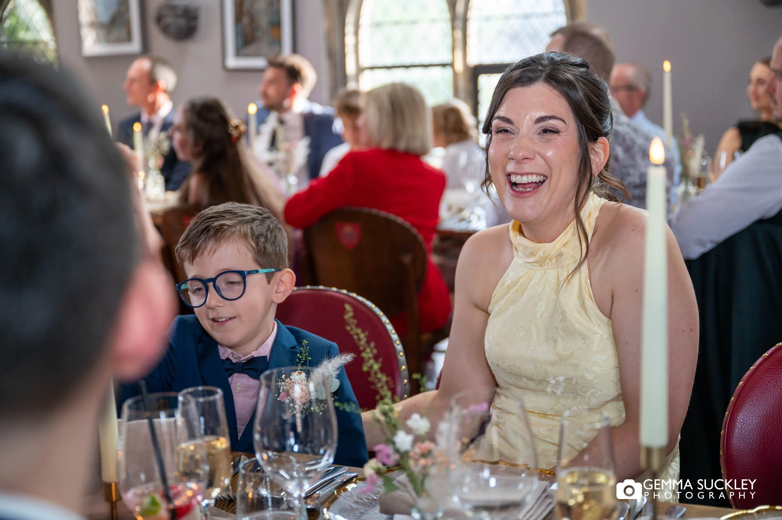 guests reacting to speeches at table decor at york minster refectory 