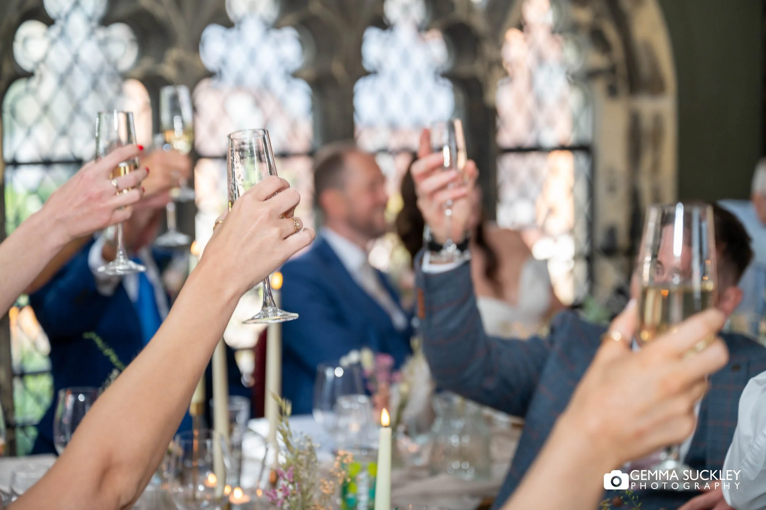wedding guests toasting during speeches