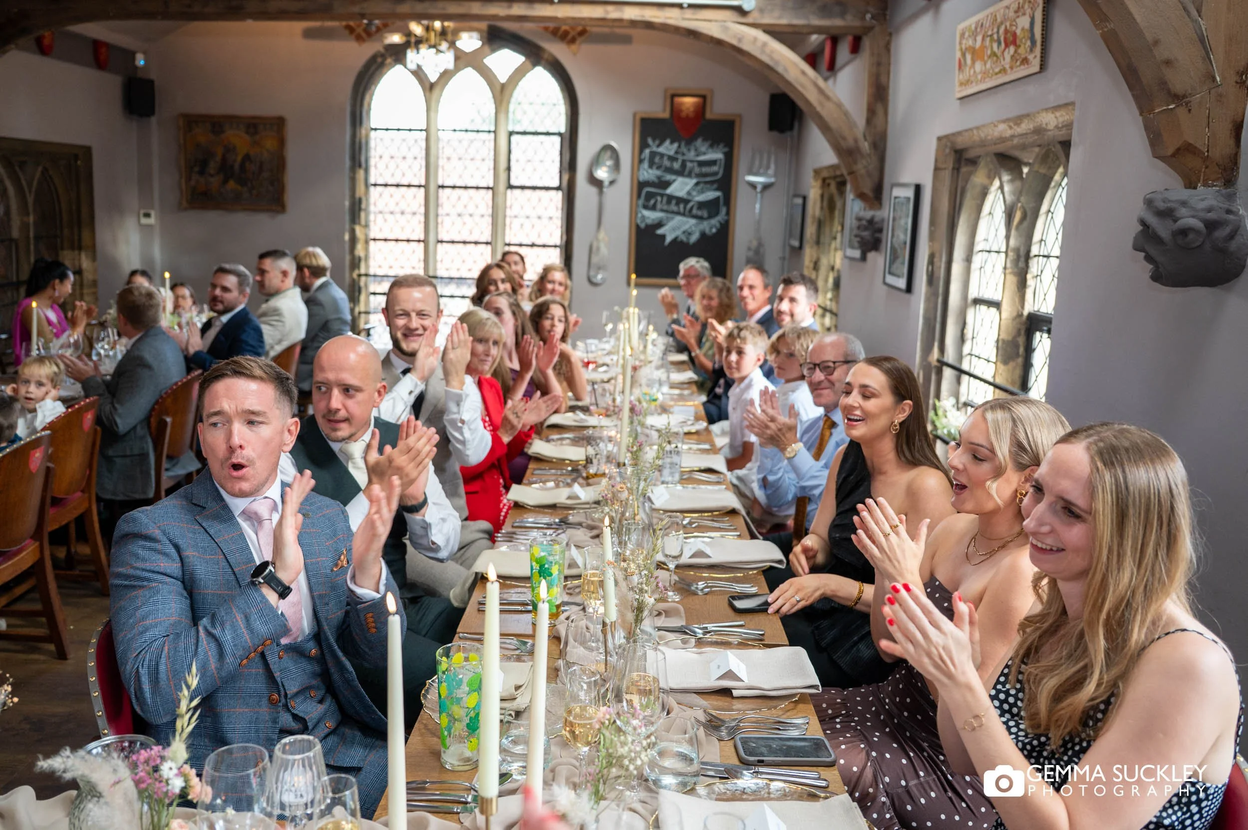 all wedding guests clapping after speeches