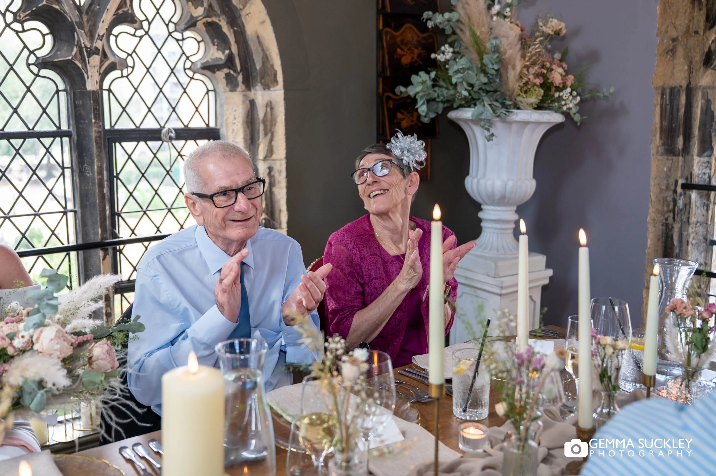 brides parents laughing at speeches