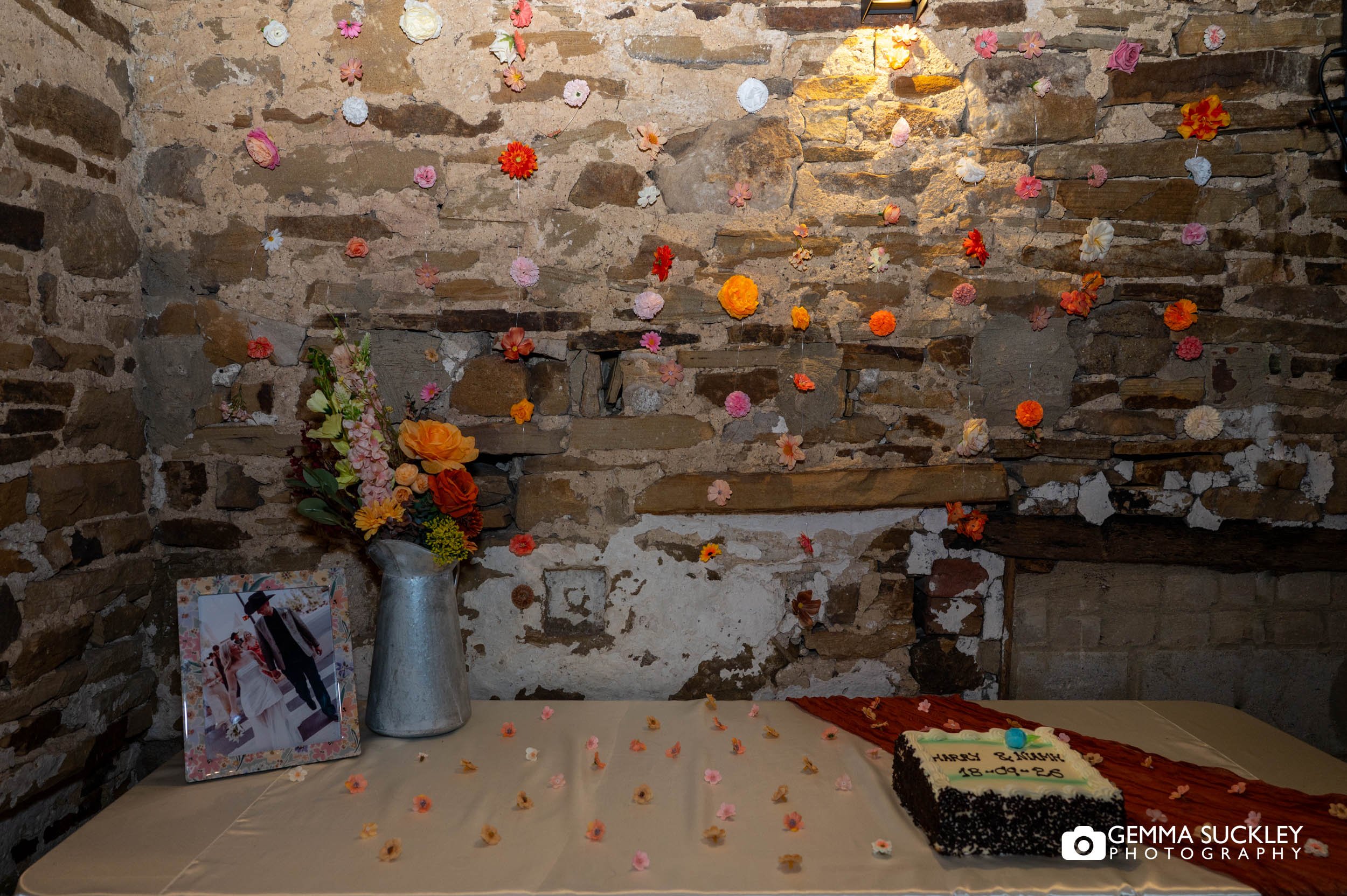 the cake table in a rustic barn