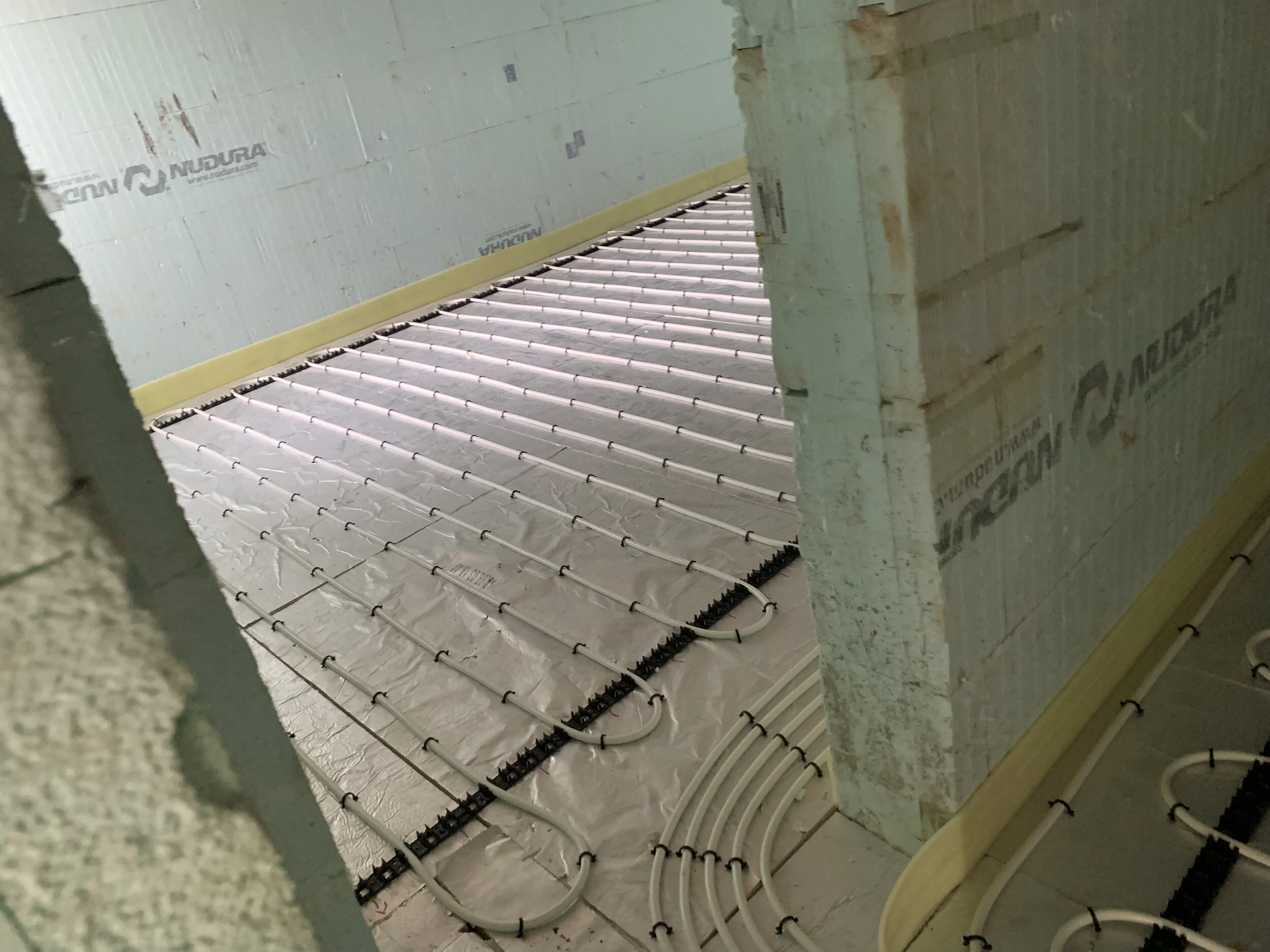 Insulation and underfloor heating pipes were then installed