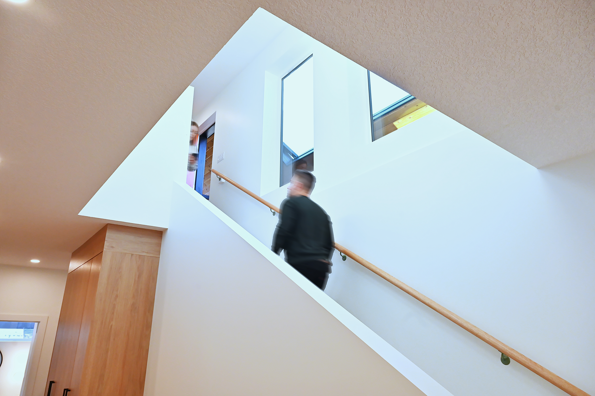 ArtHouse_Residential_Custom_Home_Infill_Windsor_Park_Edmonton_Builder_People_on_Stairs.png