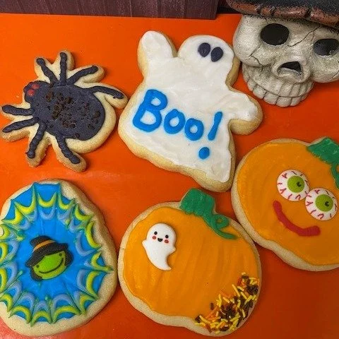 Sweeten your Halloween mood with these delightfully spooky sugar cookies! Halloween cookies are available until October 31st, then they will disappear into the darkness.  Now that's one spooky looking group! #donutmilldeer #halloween2025