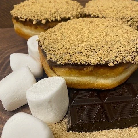Sweeten up your Long Weekend with "smore" fun! Chocolate, marshmallow, and graham cracker create this feature donut for May 15-18 ONLY.  Try one by your roaring campfire or absolutely anywhere else for that those summer vibes. #donutmillred