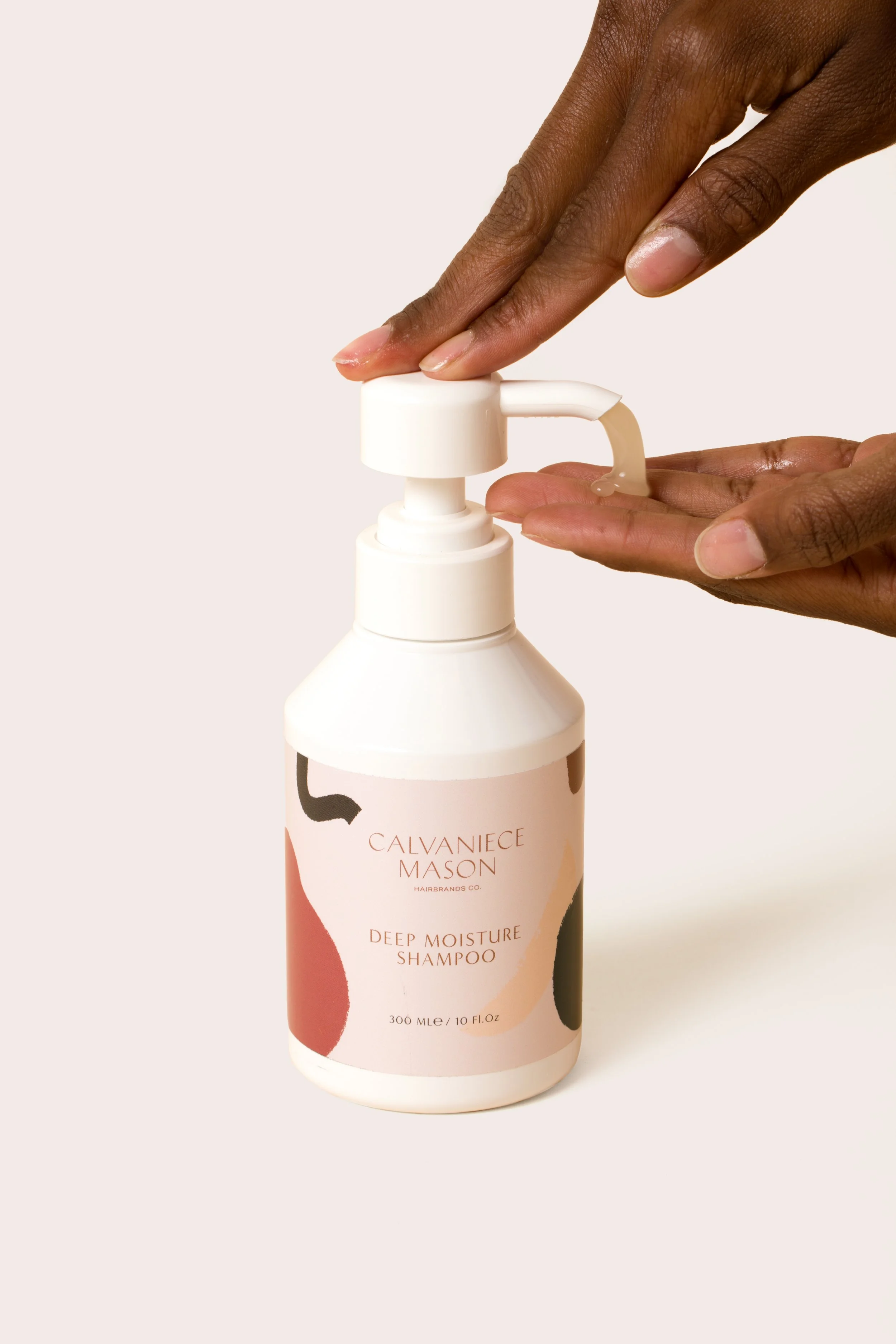 Deep Moisture Shampoo and Conditioner set for dry natural hair designed to gently cleanse, deeply hydrate and restore moisture balance for healthier, softer strands.