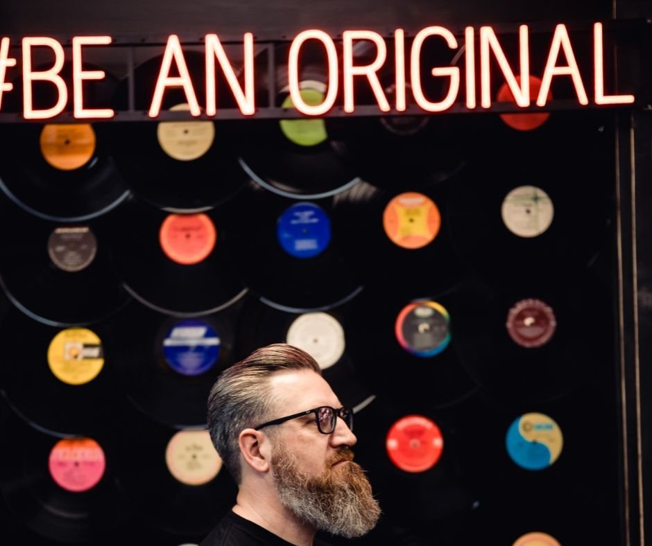 📸 Check out this dapper gent striking a pose in front of our iconic &quot;Be Original&quot; record wall! 🎸🎶 With style as smooth as his beard, he's setting the bar high for originality and flair! 🔥✨

🎶 Let's give a round of applause to our beard