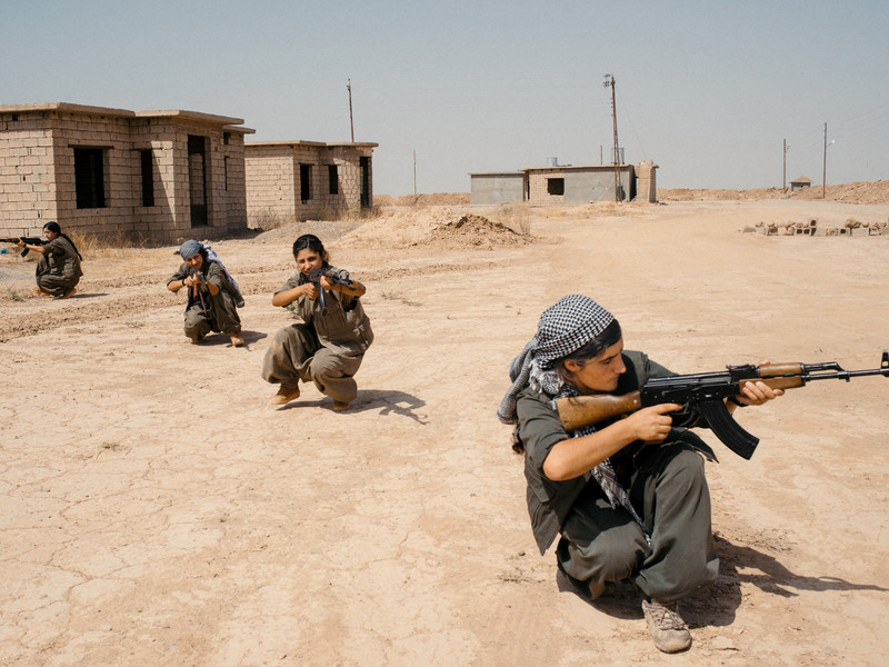 A group of PKK female fighters are training with kalashnikovs inside a PKK camp near the city of Bashir in Northern Iraq.