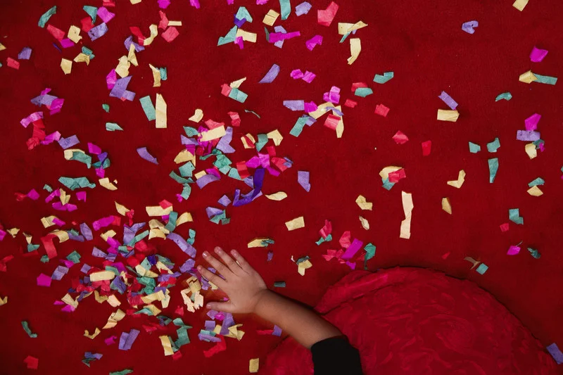 A child plays with confetti during a wedding between a Filipino woman, Mishel, and a Korean man, Jason, at The Manila Hotel. ERMITA, MANILA. 2012