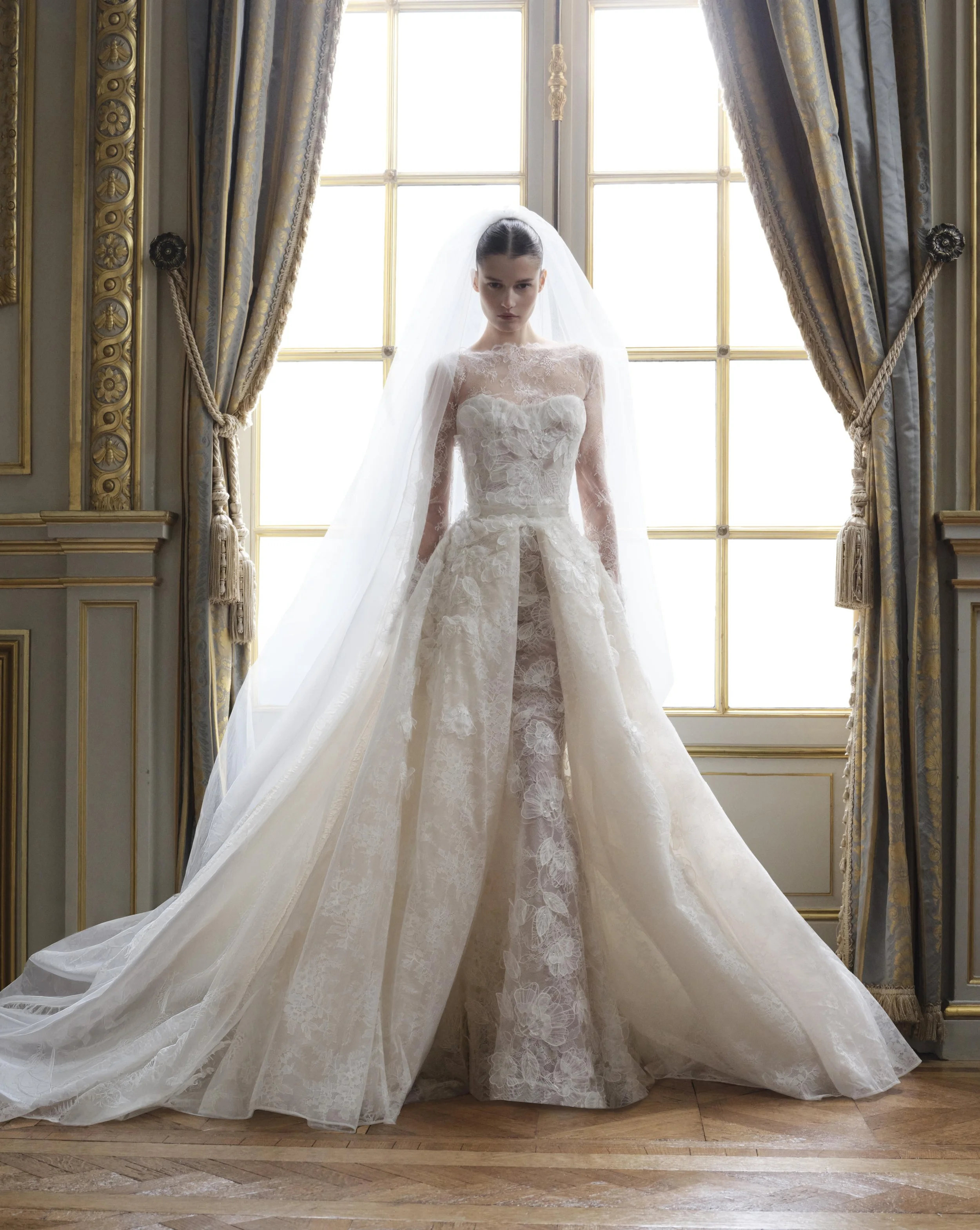 elie saab wedding dress Look 17 line tulle gown embroidered with 3D feather flower appliques and floral bouquets composed of beads and sequins. LOOK 15 - ELIE SAAB