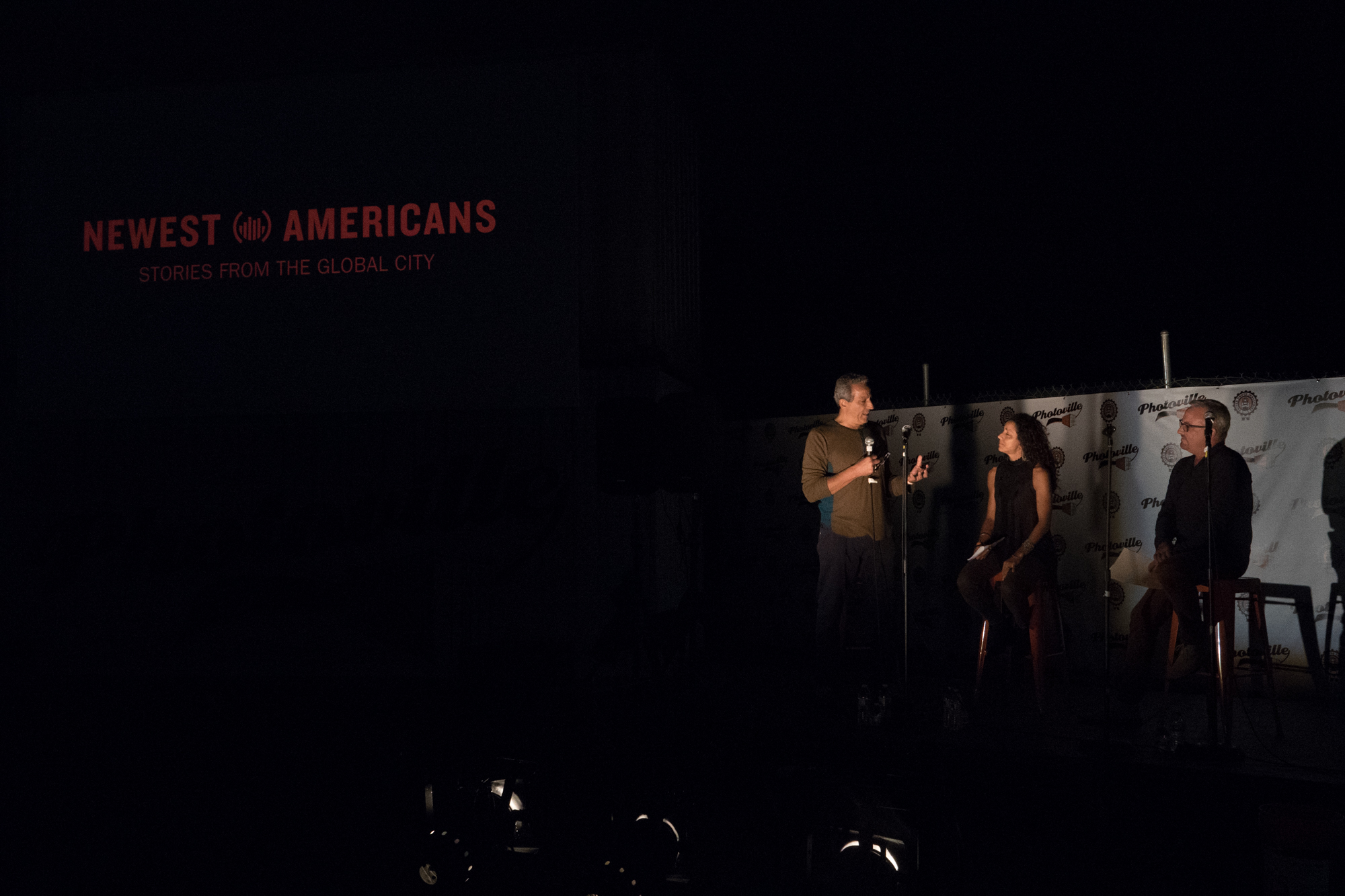  Newest Americans partners Ed Kashi, Julie Winokur, and Tim Raphael introduce the project in the Beer Garden at Photoville's Opening Night. (Photo by Stephanie Khoury) 