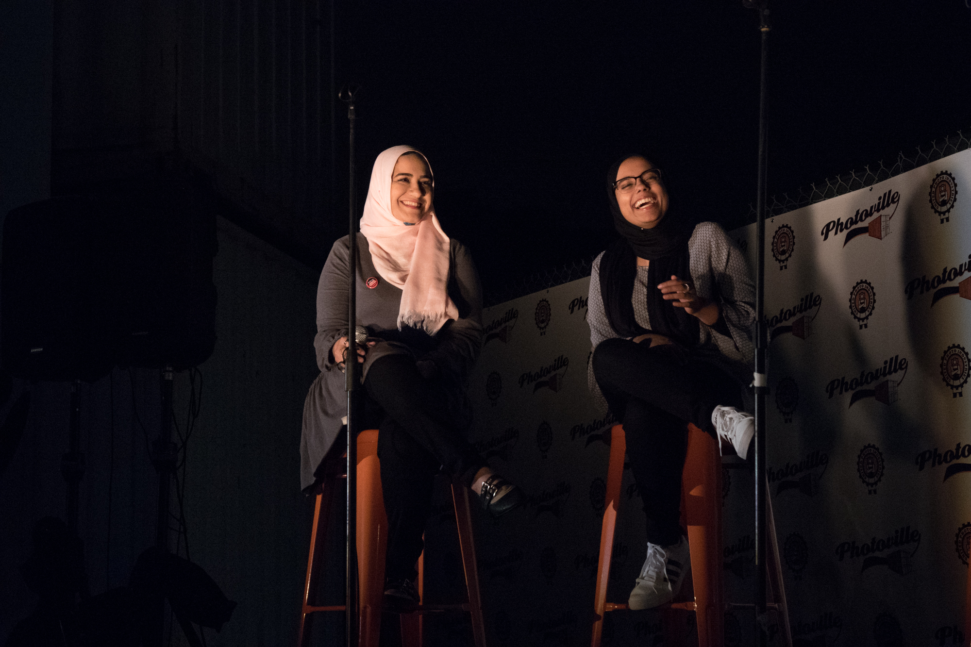  Dina Sayedahmed (left) and Hamna Saleem crack up during a Q&amp;A with Ed Kashi after screening Hijabi World at Photoville's Opening Night. (Photo by Stephanie Khoury) 