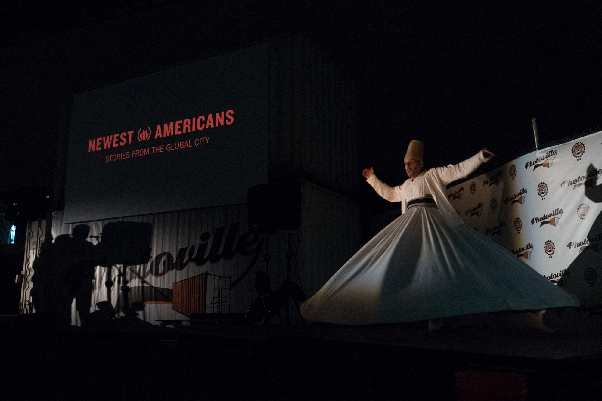  A whirling dervish spins to traditional Syrian music at the end of Newest Americans' Opening Night presentation at Photoville 2017. (Photo by Stephanie Khoury)&nbsp; 