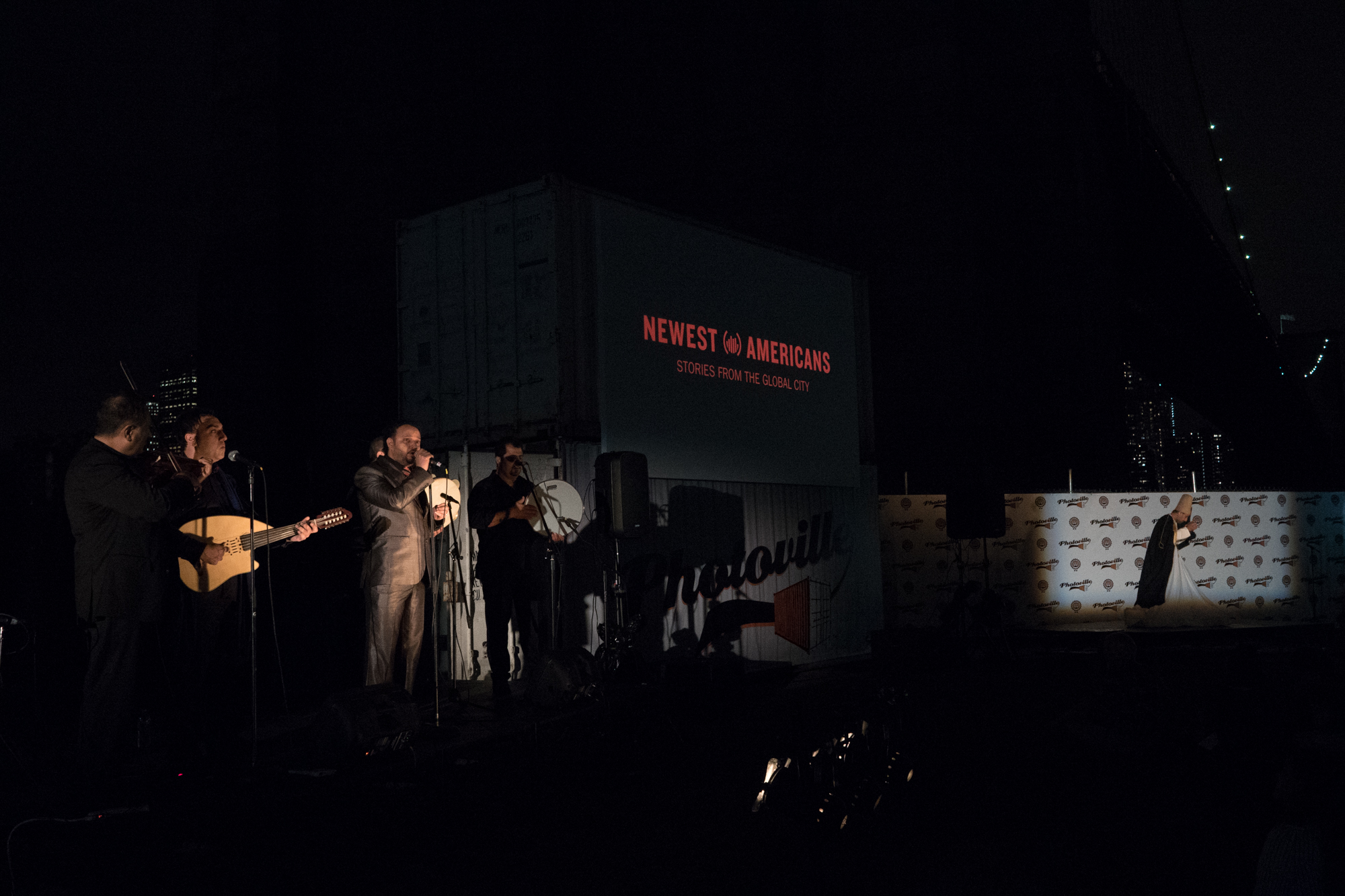  After a screening of Notes for My Homeland, Mohammed Alsaidi and company perform traditional Syrian music in Photoville's Beer Garden on Opening Night, accompanied by a whirling dervish. (Photo by Stephanie Khoury) 