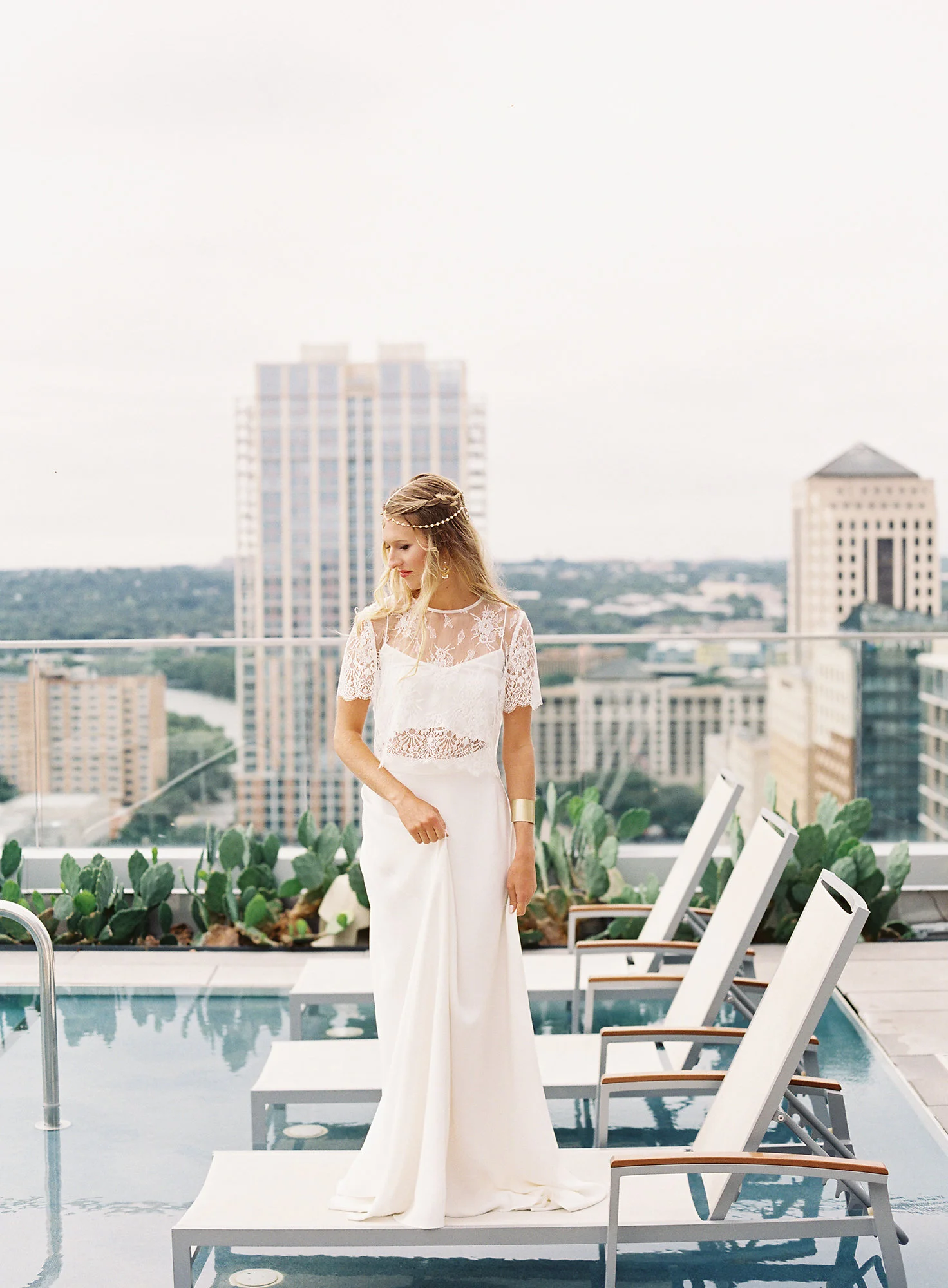 The Fashion: This crop top, lace overlay and high waisted skirt wedding ensemble from Unbridaled is one of my favorite wedding dress trends.&nbsp;