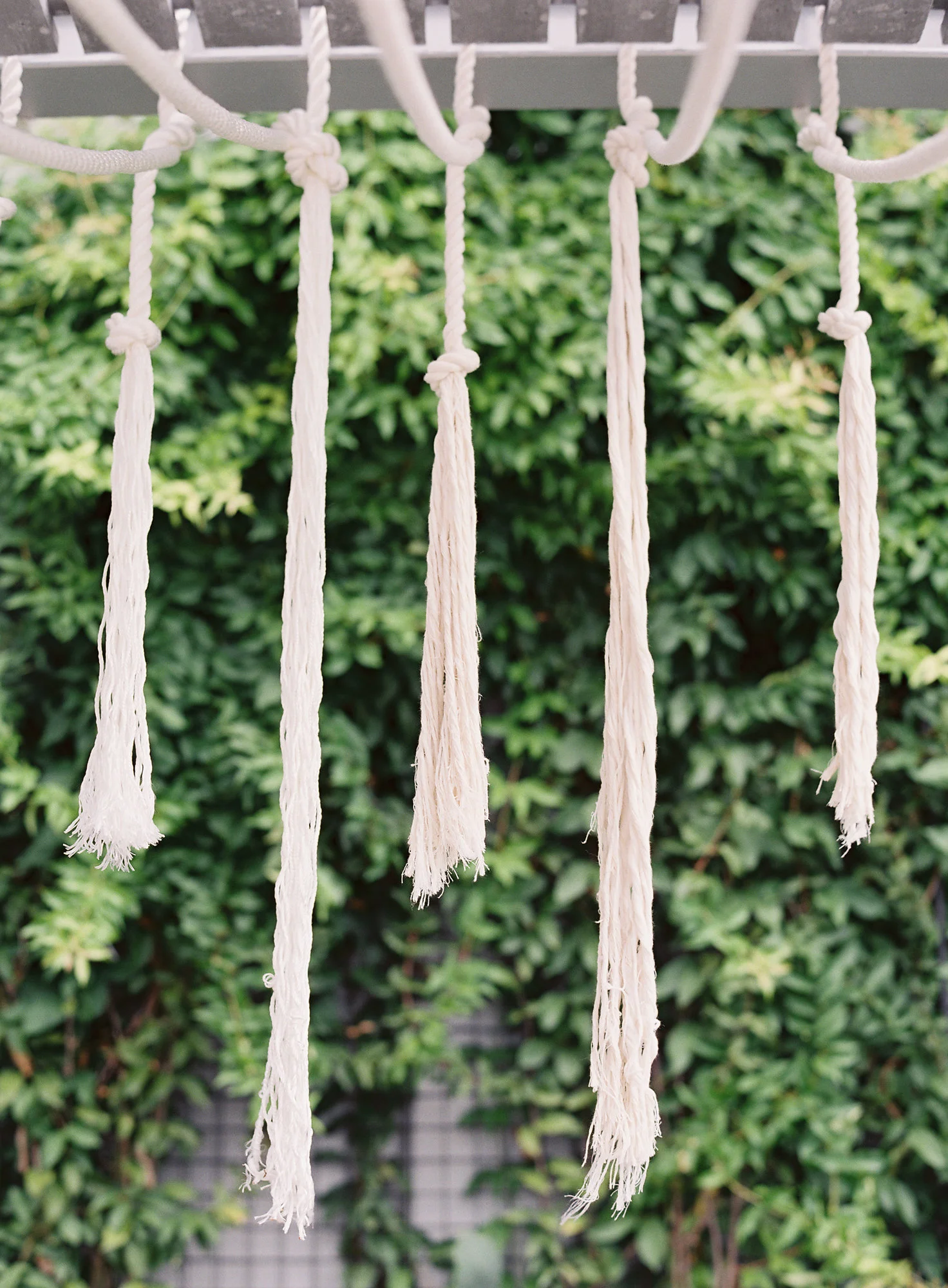 Details: Over the table we created a hanging installation of different lengths of cotton nautical rope bring the tropical theme to the entire styled space. 