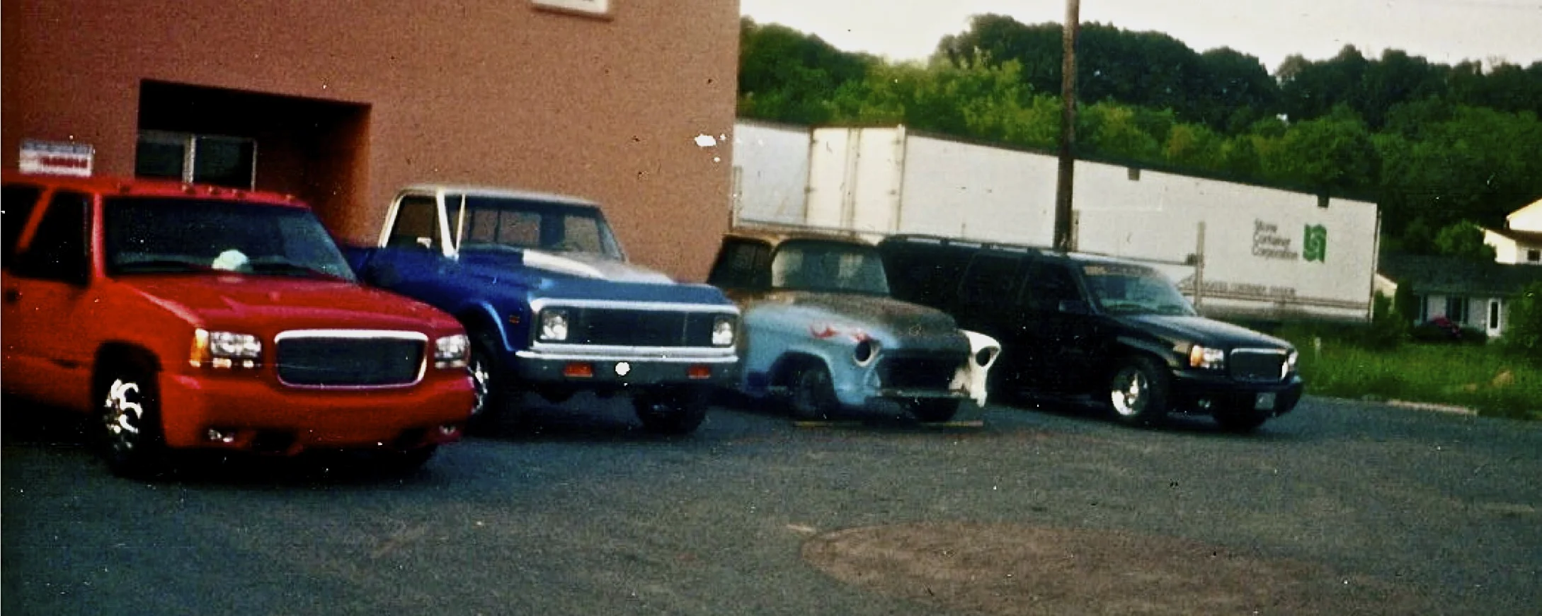 three trucks in front of shop.jpg