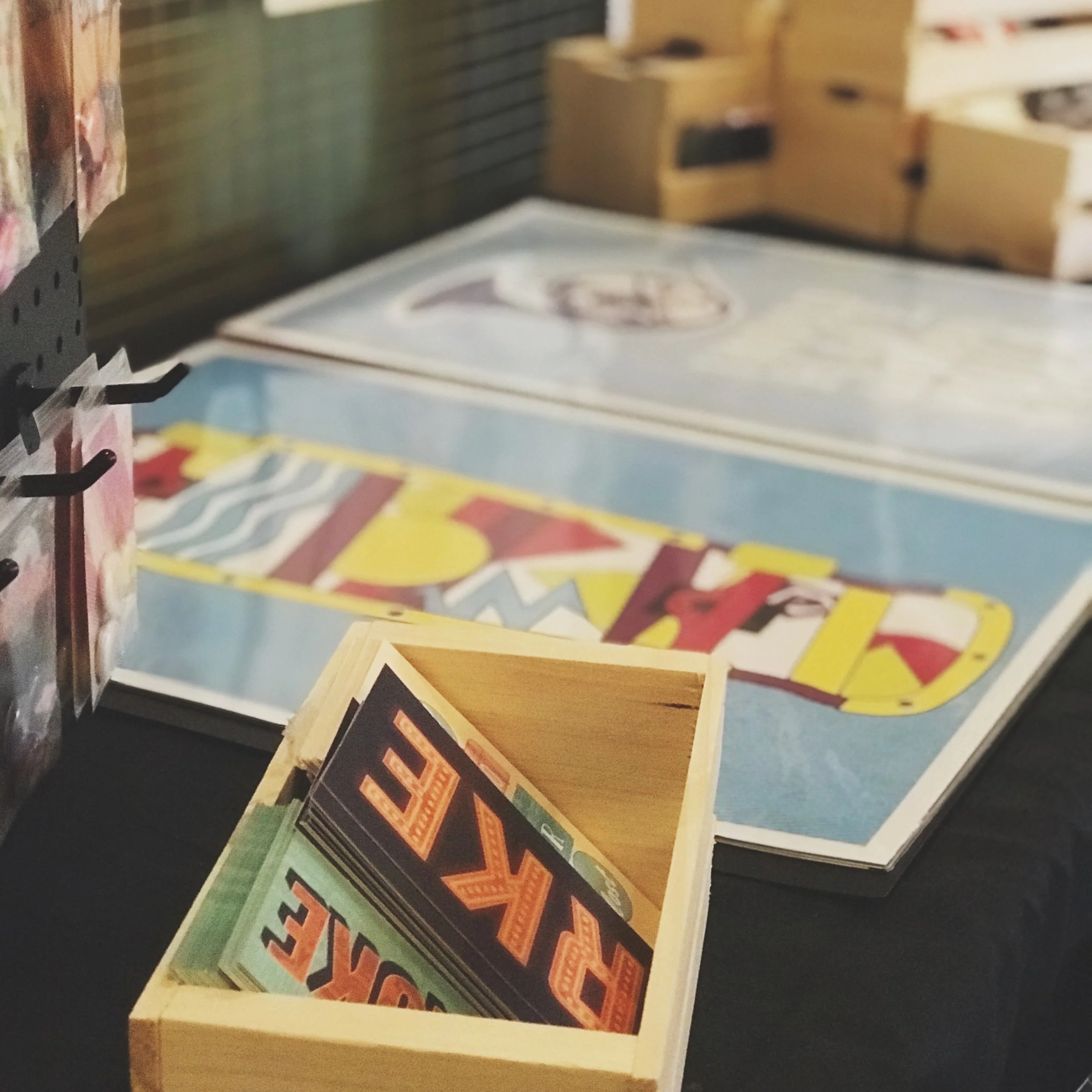Post cards and posters displayed at Riot Rooster