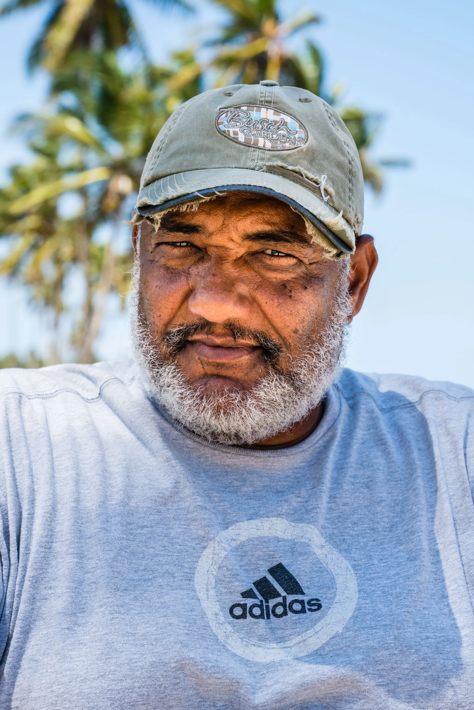 A man wears an ‘Adidas’ t-shirt. Un-named Beach, Dominican Republic. 2018