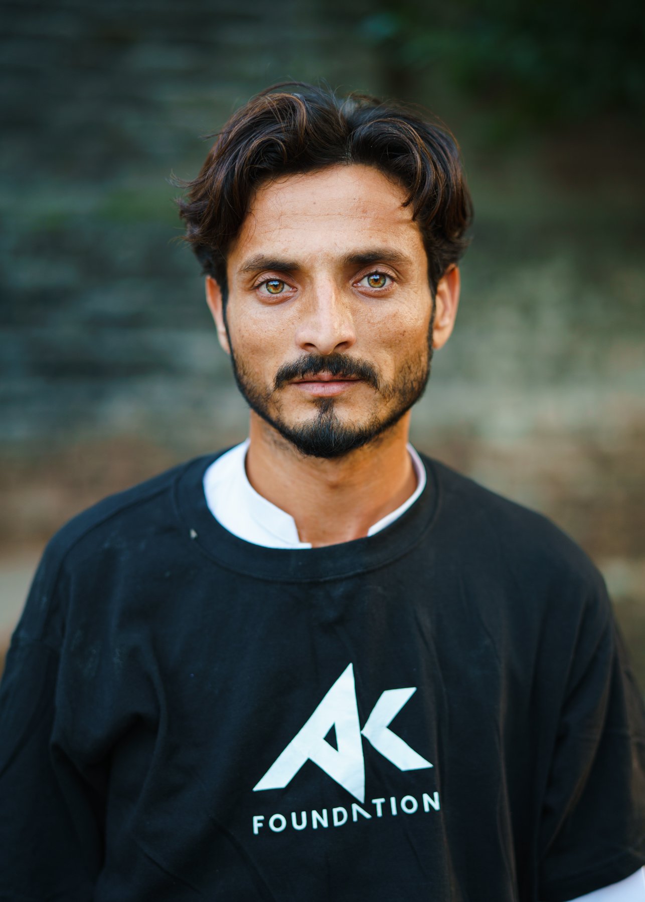  Portrait of volunteer for the Amir Khan Foundation.   Pakistan, 2022 