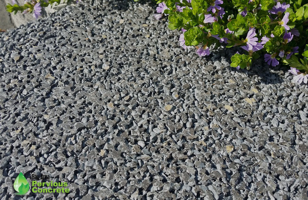 Decorative Colored Polished Pervious Concrete - Basalt aggregate with dark grey integral color