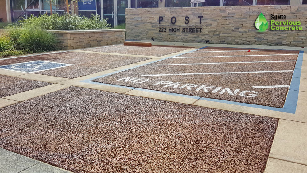 Classic Colored Pervious Concrete with traditional concrete border - Post St Office Parking Stalls - Palo Alto, CA