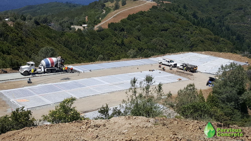  Pervious concrete helicopter pad and parking stalls being installed at Mt Umunhum Summit, curing under plastic. 