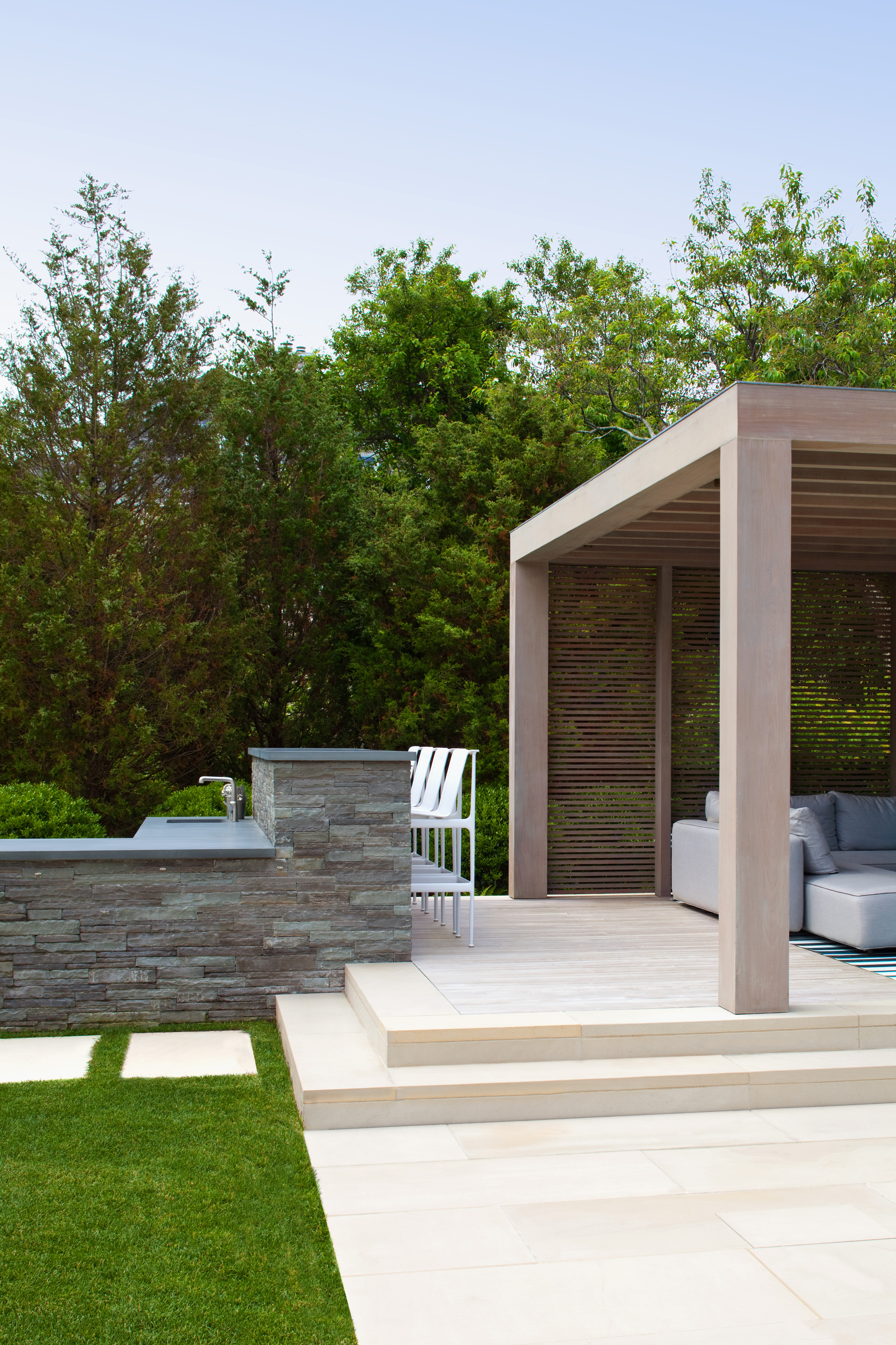 10. Custom outdoor kitchen adjacent to raised lounge area..jpg