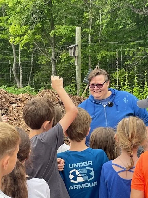 Baylee teaches Lyme Students about composting