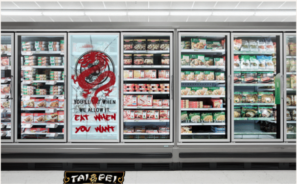 PRESSURE SENSING DECALS CHANGE AUTHORITARIAN STYLE ADS ON THE DOOR TO AN IMAGE OF A CRACKED SCREEN AND THE DRAGON SYMBOL.PRESSURE SENSING DECALS CHANGE AUTHORITARIAN STYLE ADS ON THE DOOR TO AN IMAGE OF A CRACKED SCREEN AND THE DRAGON SYMBOL.