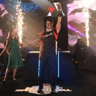 Andrea Mengucci holding his Invitational Trophy