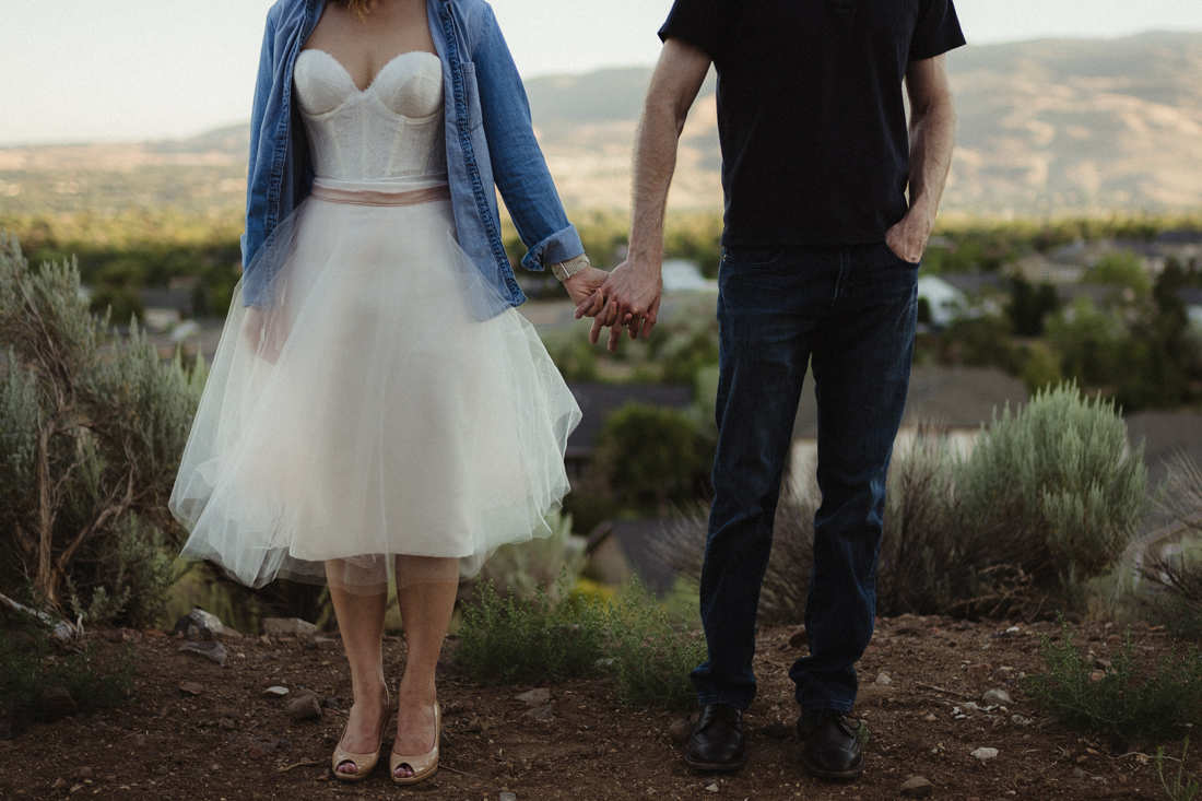 Husband and wife holding hands at Keystone Canyon in Reno, NV