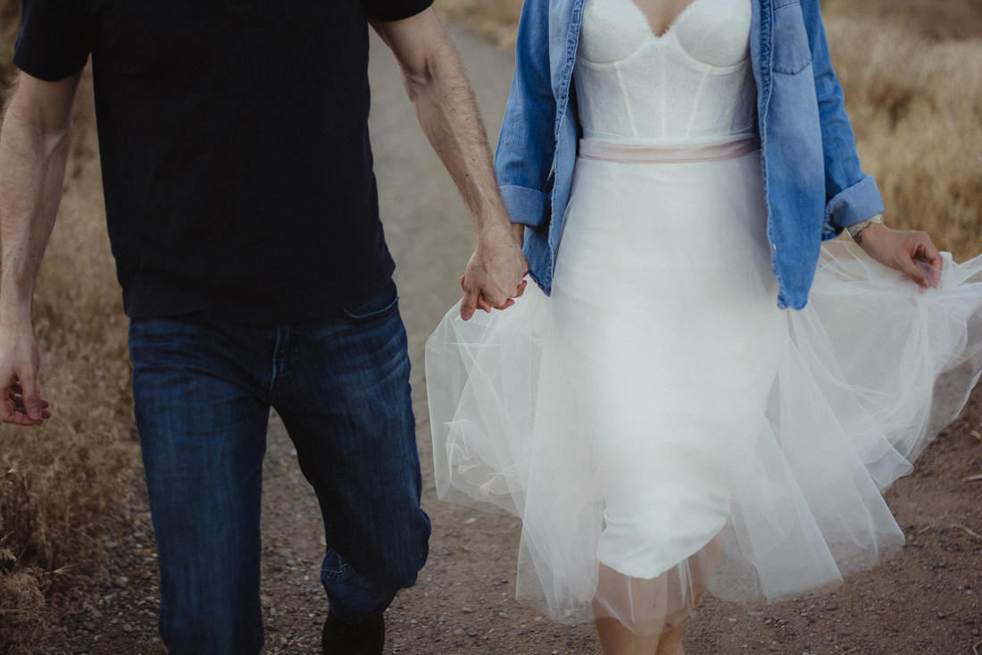 Husband and wife holding hands for their anniversary pictures