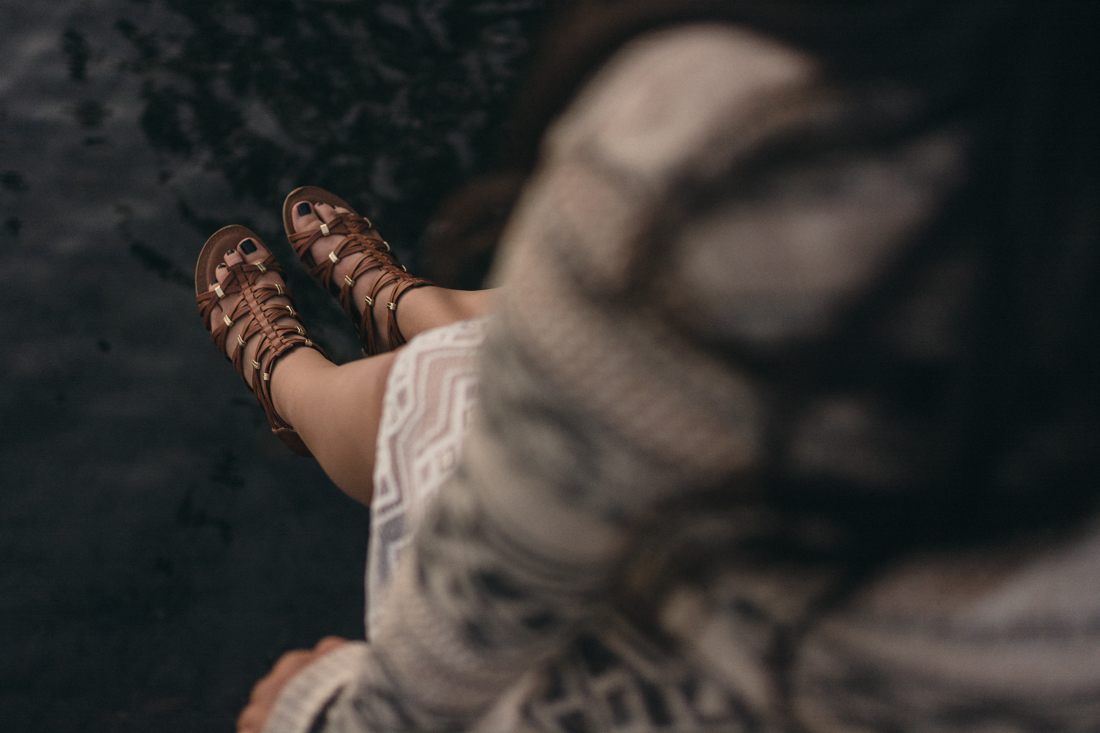 Lake Tahoe senior pictures of a girls feet swinging at a dock at Donner Lake
