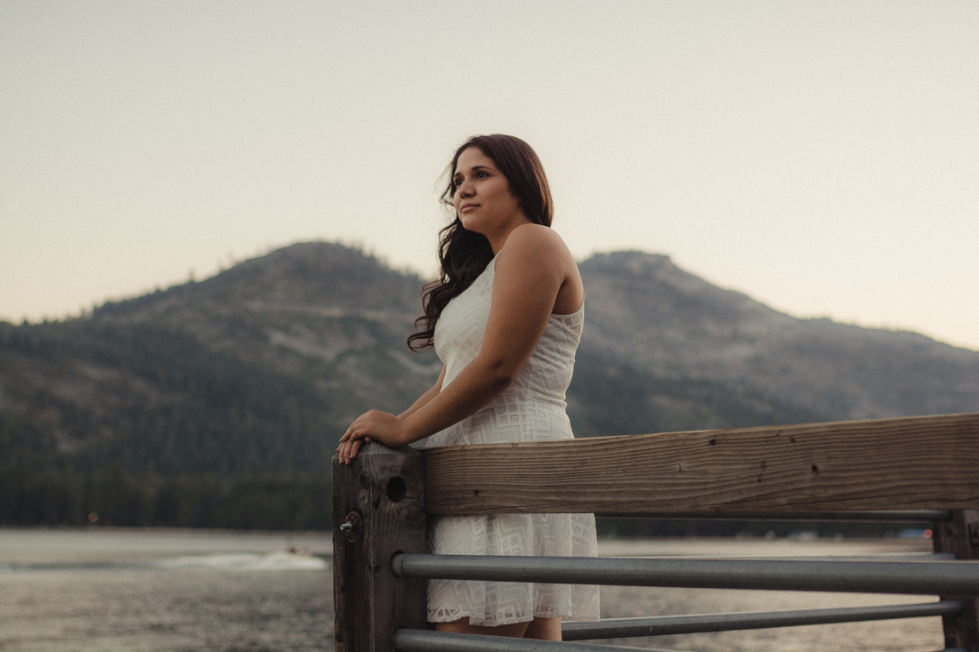 Lake Tahoe senior pictures of a girl looking out on a dock at Donner Lake 