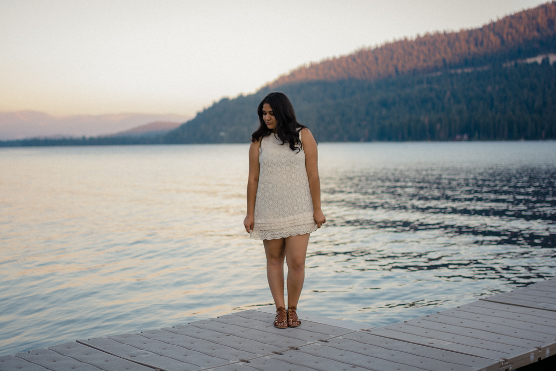 Lake Tahoe senior pictures of a girl standing on a dock at Donner Lake 