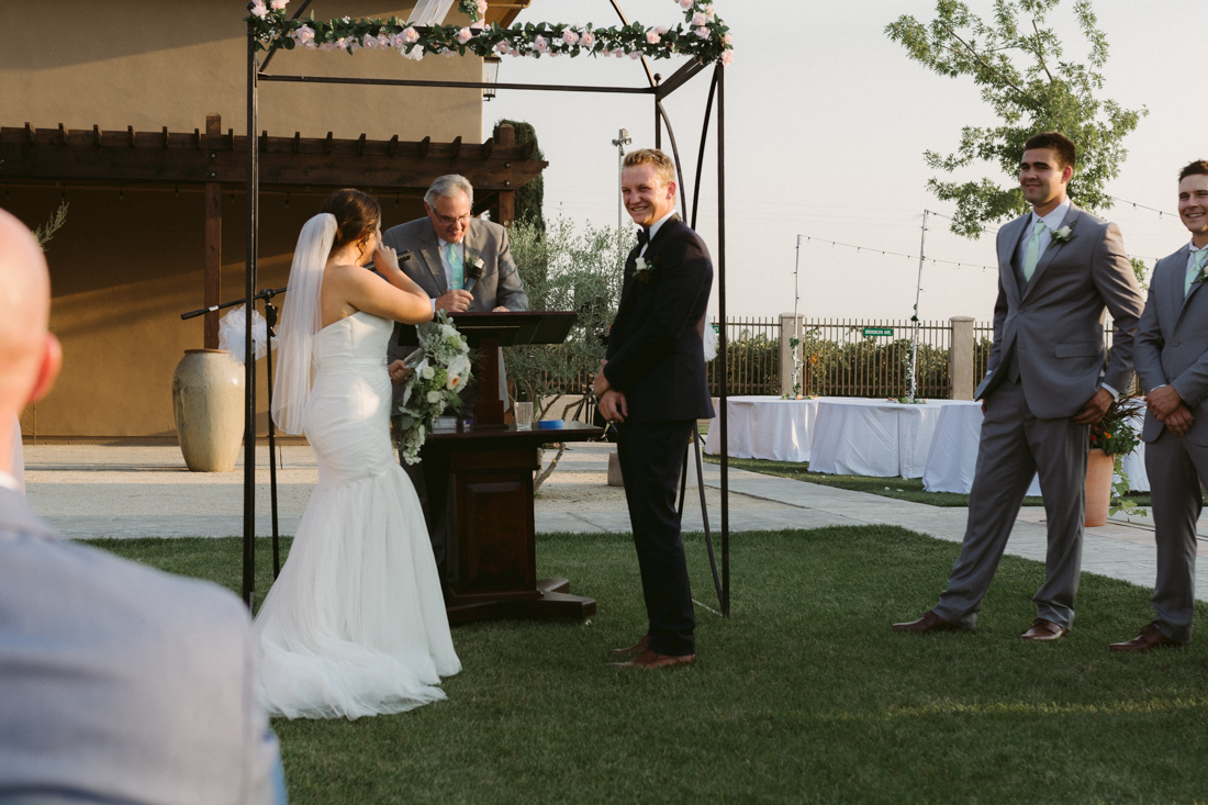 California Wedding private venue bride laughing during the wedding ceremony   