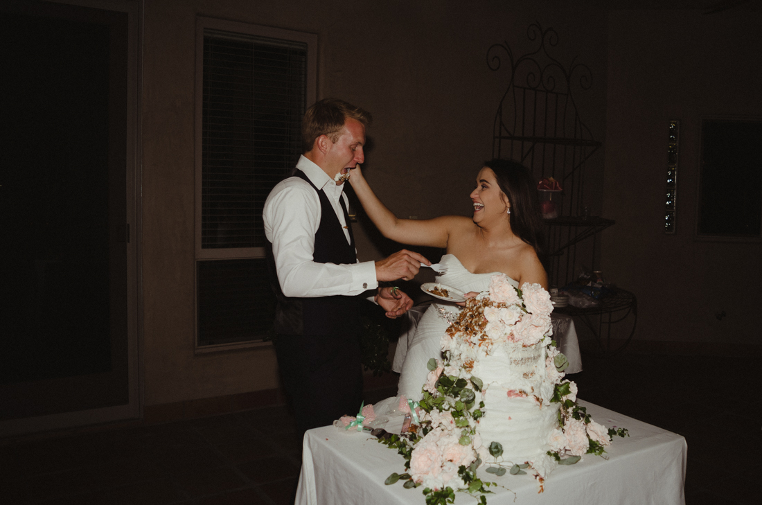 California Wedding private venue  bride and groom cutting the cake photo