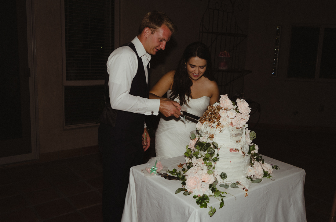 California Wedding private venue  bride and groom cutting the cake photo