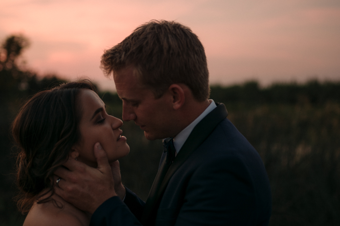   California Wedding private venue bride and groom going in for a kiss photo   