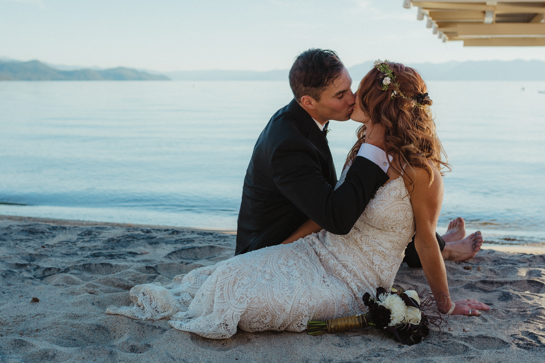 Incline village beach wedding couple sitting by the beach photo
