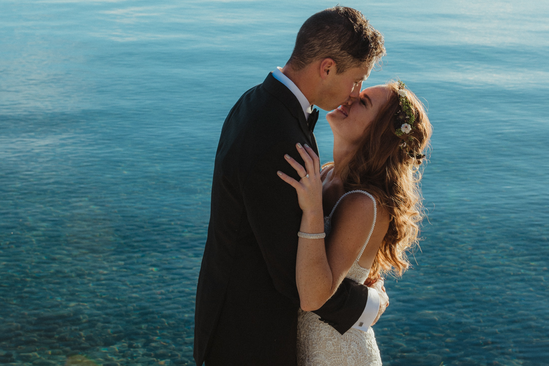 Incline village beach wedding couple embracing photo 