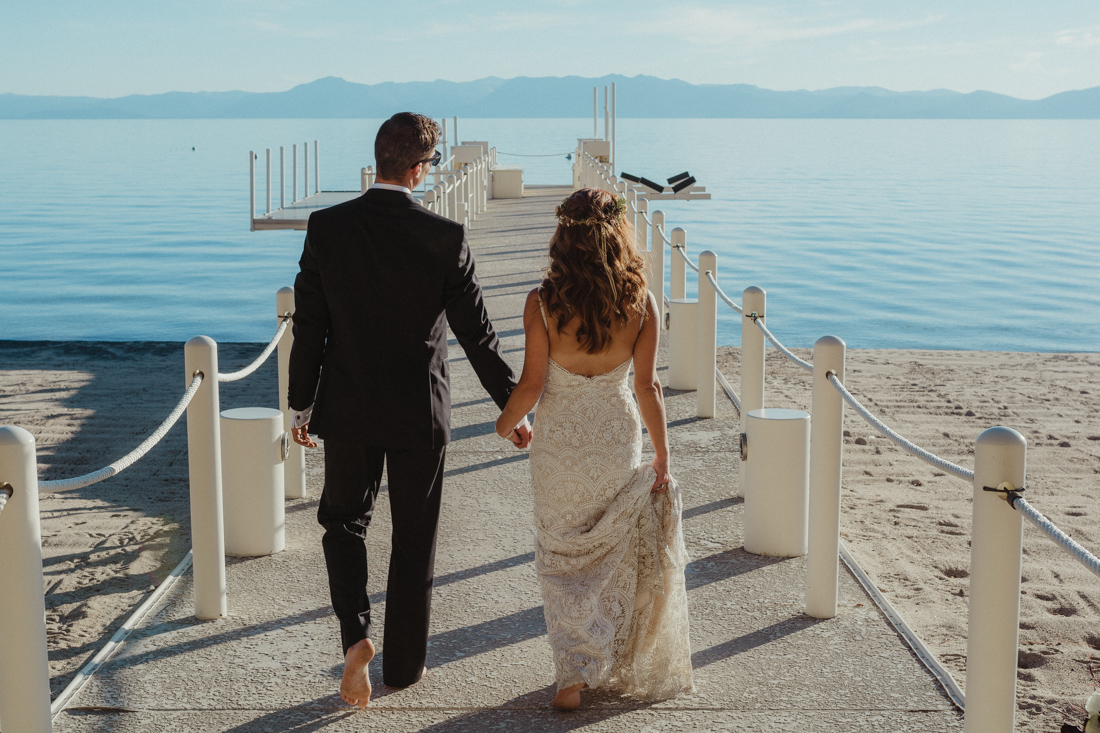Incline village beach wedding couple walking on the dock photo 