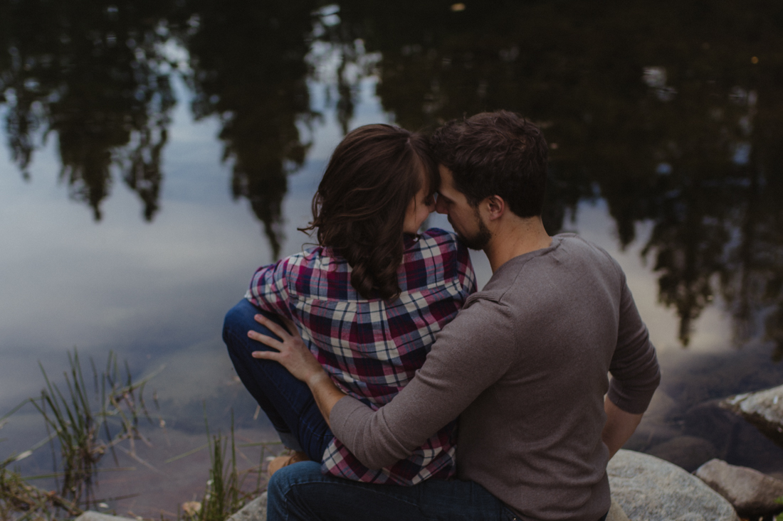 Galena Creek Fish Hatchery engagement session couple resting their foreheads on each other photo