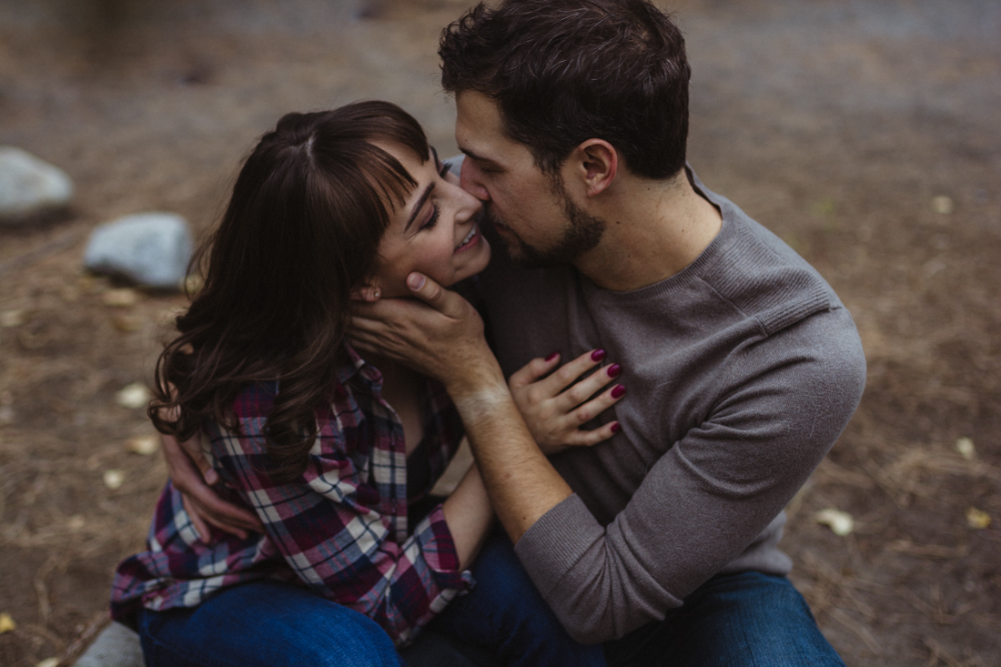 Galena Creek engagement session couple going in for a kiss photo