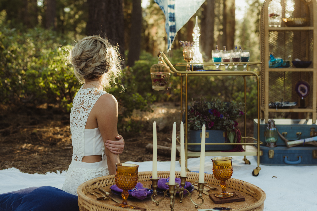 Bohemian styled shoot bride lounging photo