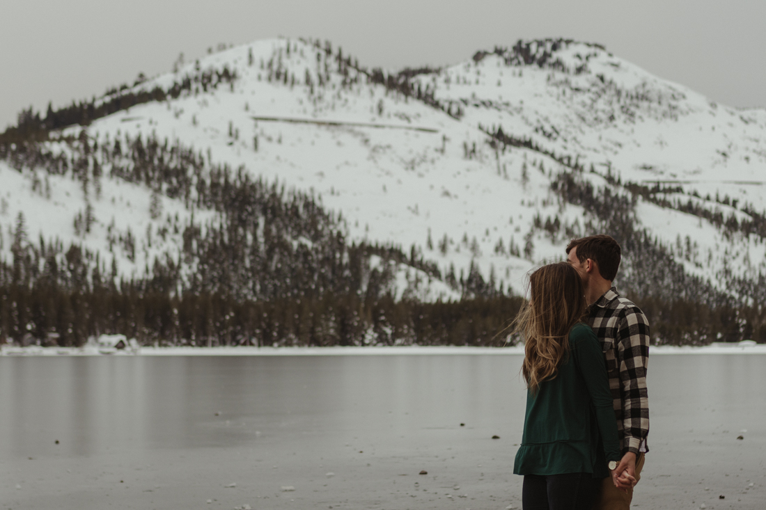 Couple hugging on the shore of Donner Lake in Donner CA